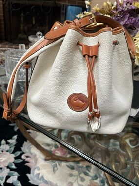 Dooney & Bourke White and Tan Pebbled Leather Drawstring Bucket Bag
